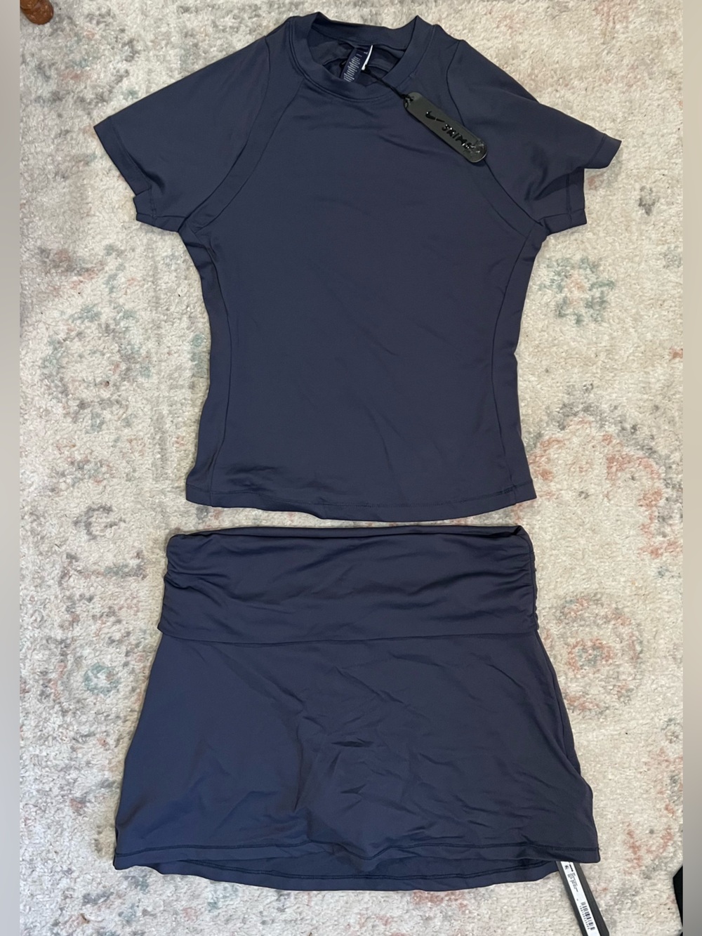 Skims airy baby tee + foldover skort set